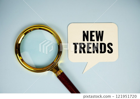 New Trends text on speech bubble with magnifying glass top 121951720