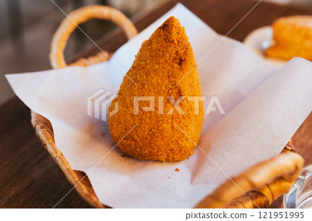 Arancini, a Sicilian snack Arancini, a Sicilian snack 121951995