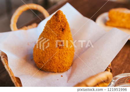 Arancini, a Sicilian snack Arancini, a Sicilian snack 121951996