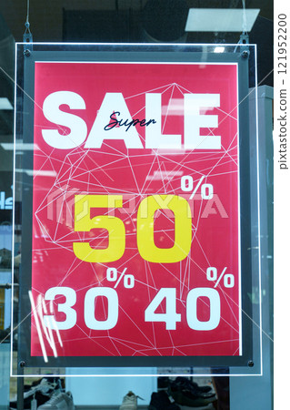 Exciting sale announcement featuring discounts for shoppers in a vibrant store Exciting sale announcement featuring discounts for shoppers in a vibrant store 121952200