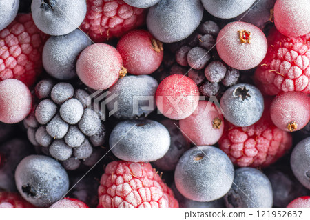 frozen berries of various colors covered with frost in large quantities 121952637