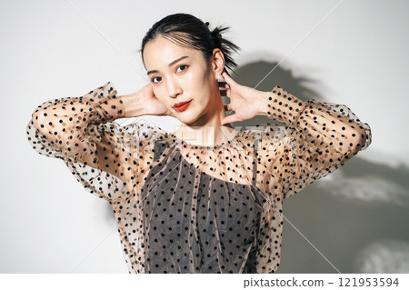 Portrait of a woman in see-through clothing Portrait of a woman in see-through clothing 121953594