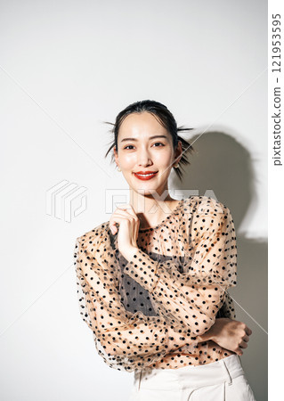 Portrait of a woman in see-through clothing 121953595