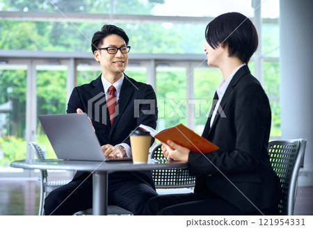 Businessmen meeting in the office 121954331