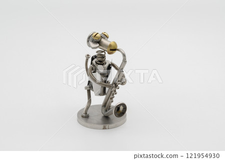 Metal figure of a dog playing the saxophone Metal figure of a dog playing the saxophone 121954930