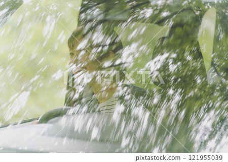 Women driving alone Women driving alone 121955039