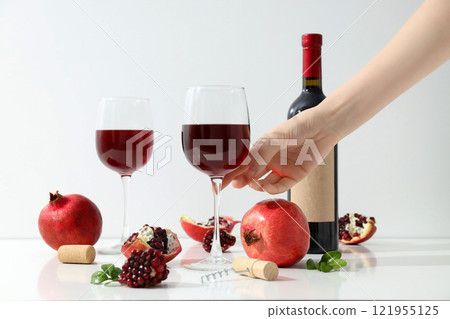 Pomegranate wine, concept of delicious alcohol drink Pomegranate wine, concept of delicious alcohol drink 121955125
