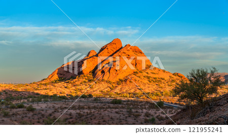 Red sandstone butte of Papago Park with many caverns caused by erosion, in Phoenix, Arizona, United States Red sandstone butte of Papago Park with many caverns caused by erosion, in Phoenix, Arizona, United States 121955241