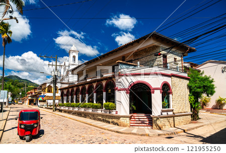 Traditional red tuk-tuk mototaxi in Copan Ruinas town near the Mayan archaeological site of Copan in Honduras 121955250