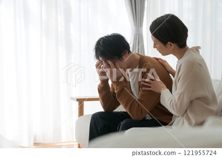 A depressed husband and an encouraging wife A depressed husband and an encouraging wife 121955724