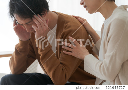 A depressed husband and an encouraging wife A depressed husband and an encouraging wife 121955727