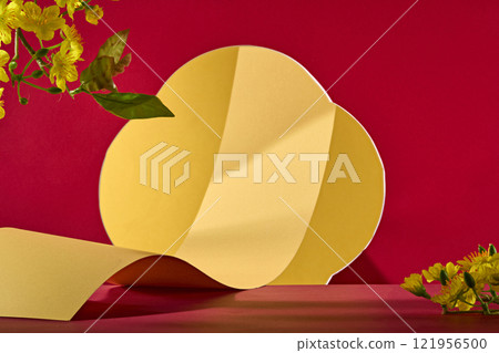A gold paper roll is visible through a cloud-shaped hole in frontal view. A blank space for presenting products, adorned with a few branches of yellow apricot. The theme is Lunar New Year. 121956500