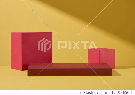 Chinese New Year concept for product advertisement image. Frontal view of some red podium with an empty space for presentation product, placed on a light golden background. 121956506