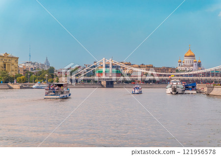 Cruise ship sails on the Moscow river in Moscow city center, popular place for walking. Cruise ship sails on the Moscow river in Moscow city center, popular place for walking. 121956578