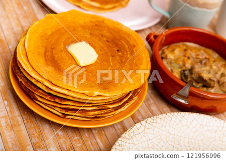 Pancakes with meat and vegetables stew machanka Pancakes with meat and vegetables stew machanka 121956996