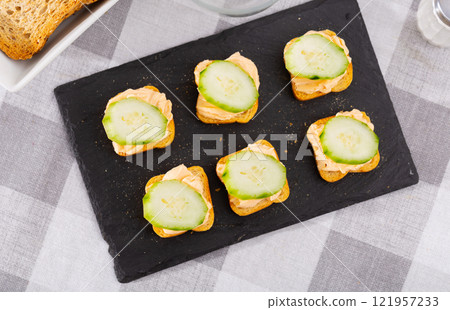 Tasty snack before lunch - sandwiches with cucumber and pate 121957233
