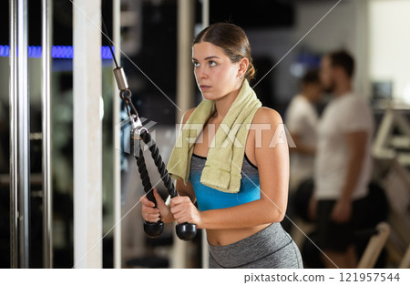 Woman doing arm exercises 121957544