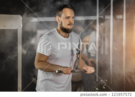 Man doing arm training Man doing arm training 121957572