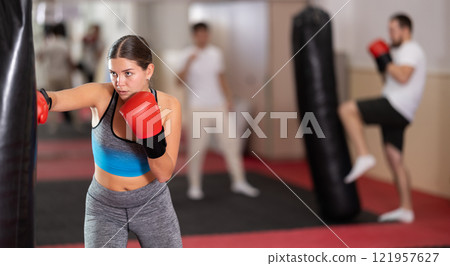 Woman training in boxing section Woman training in boxing section 121957627