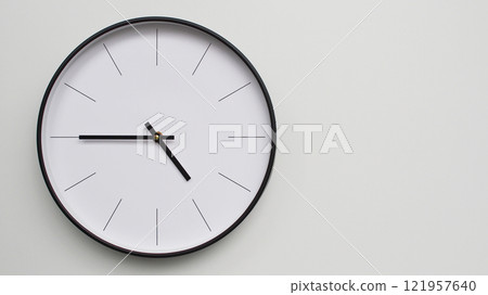 Wall Clock Showing 16.45/04.45 O'Clock on White Wooden Surface - Perfect for Time Management and Scheduling Concepts Wall Clock Showing 16.45/04.45 O'Clock on White Wooden Surface - Perfect for Time Management and Scheduling Concepts 121957640