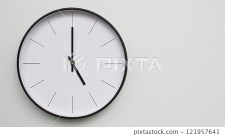 Wall Clock Showing 17.00/05.00 O'Clock on White Wooden Surface - Perfect for Time Management and Scheduling Concepts 121957641
