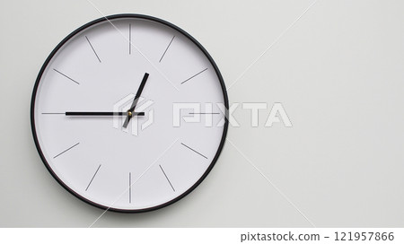 Wall Clock Showing 12.45/06.45 O'Clock on White Wooden Surface - Perfect for Time Management and Scheduling Concepts 121957866