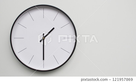 Wall Clock Showing 13.30/01.30 O'Clock on White Wooden Surface - Perfect for Time Management and Scheduling Concepts 121957869