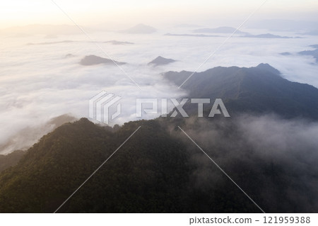Landscape of Morning Mist with Mountain Layer at north of chiang rai Thailand. mountain ridge and clouds in rural jungle bush forest Landscape of Morning Mist with Mountain Layer at north of chiang rai Thailand. mountain ridge and clouds in rural jungle bush forest 121959388