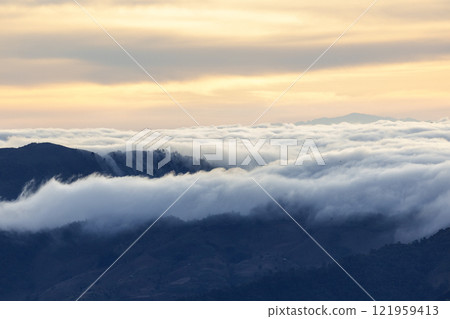 Landscape of Morning Mist with Mountain Layer. mountain ridge and clouds in rural jungle bush forest Landscape of Morning Mist with Mountain Layer. mountain ridge and clouds in rural jungle bush forest 121959413