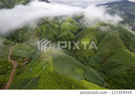 Landscape of Morning Mist with Mountain Layer. mountain ridge and clouds in rural jungle bush forest 121959449