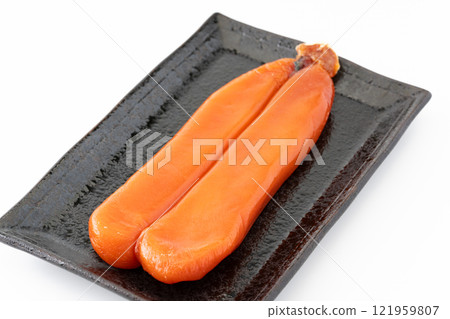A whole bunch of dried mullet roe on a plate A whole bunch of dried mullet roe on a plate 121959807