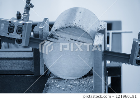 The band saw cutting machine cutting the metal shaft parts with coolant method in the light blue scene. 121960181