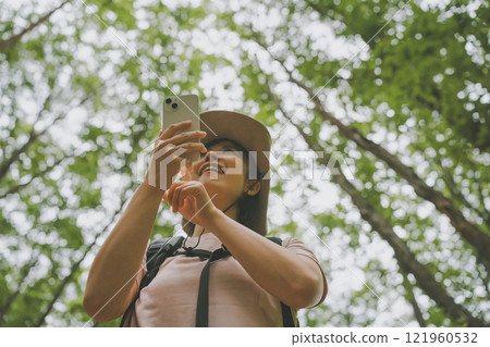 Summer mountain climbing and smartphones 121960532