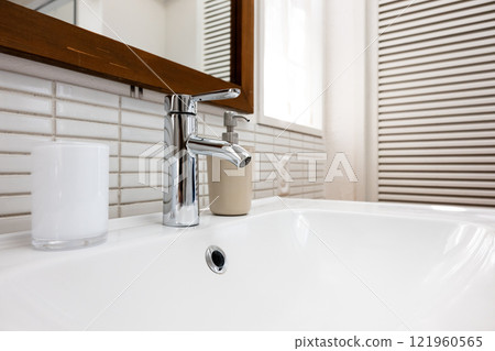 Water tap at the sink Water tap at the sink 121960565