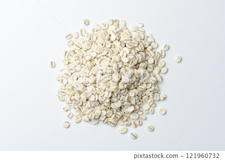 Aerial view of rolled barley piled up on white background 121960732