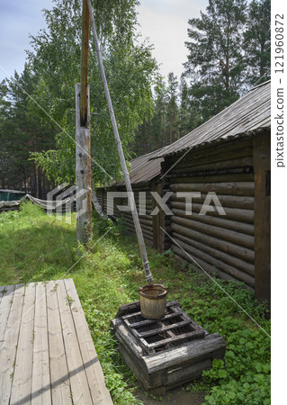 A well with a crane lifting mechanism of the 19th century in Ulan-Ude, Russia 121960872
