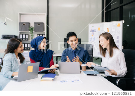 Creative business people working on business project in office 121960881