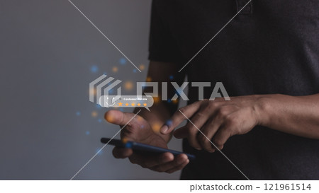 Customer Review, Young Man hand holding Smart Phone with five star to review and give 5 stars  121961514
