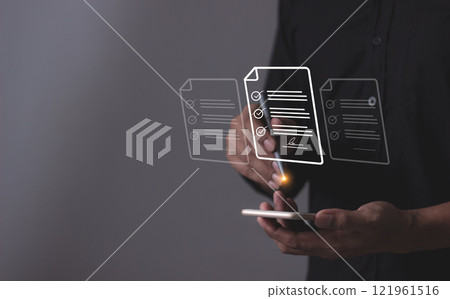 Young man with smartphone mobile hand using a pen touching to sign a Online Business Contract 121961516