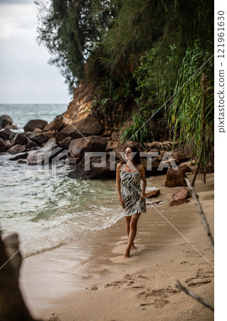 Serene Beach Stroll Enjoying a Beautiful Moment by the Shoreline during the Summer 121961630
