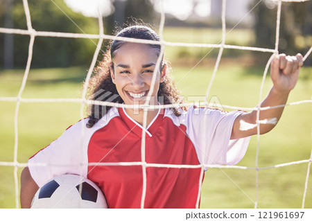Happy, motivation and woman soccer player with a football ready for a workout, match or exercise. Portrait of a teen student girl in a sport uniform before fitness and school sports training field 121961697