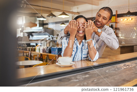 Wow, surprise and romantic boyfriend covering his girlfriends eyes for a present at a restaurant, coffee shop or cafe store. A happy birthday gift to celebrate their love, couple and woman together 121961736