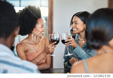 Friends having fun and drinking wine, toasting, bonding and celebrating at an event or party. Diverse friends cheers and laughing, enjoying free time, dining experience and wine tasting gathering 121962130