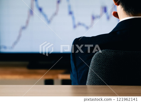 Businessman looking at chart Businessman looking at chart 121962141