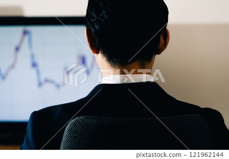 Businessman looking at chart Businessman looking at chart 121962144