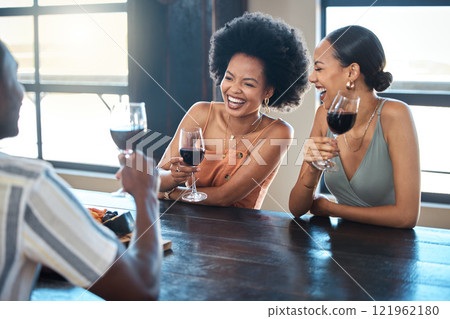 Friendship, fun and celebration with a happy group bonding and drinking wine together at a restaurant. Diverse friends laughing, getting drunk and carefree, celebrating good news and freedom 121962180