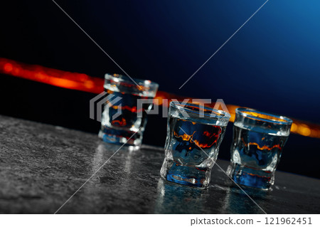 Vodka on a dark blue background. 121962451