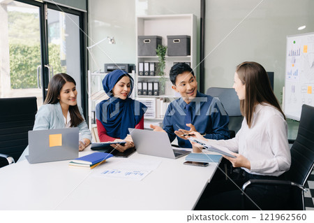 Multiracial group of young creative people in smart casual wear discussing business brainstorming meeting ideas design project. 121962560