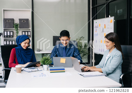 Business team discuss at meeting room. working together with laptop ,tablet and smart phone on desk Financial accountant , planner , meeting , introduction concept. 121962828