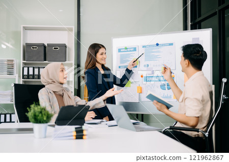 Group of Asian business meeting in planning design in creative business discussing work 121962867